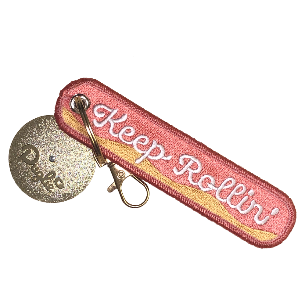Keep On Rollin' Spinning Key Tag